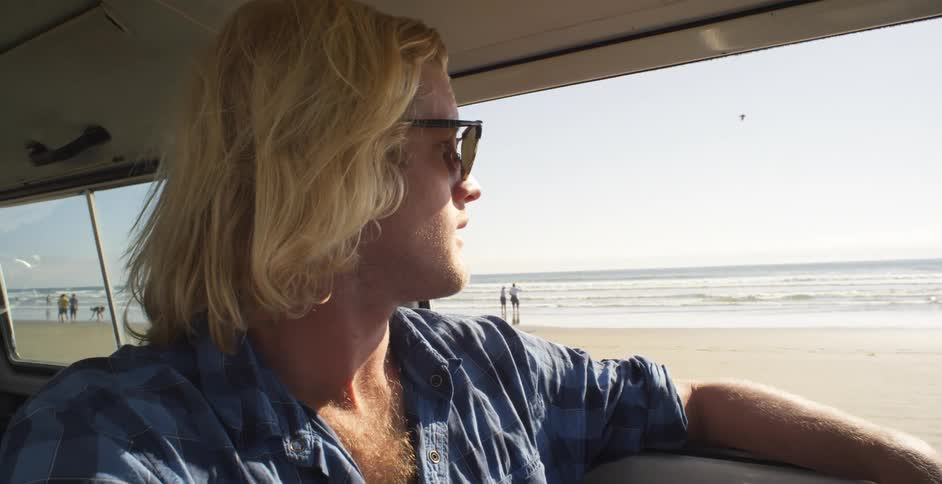 A man rides on the beach