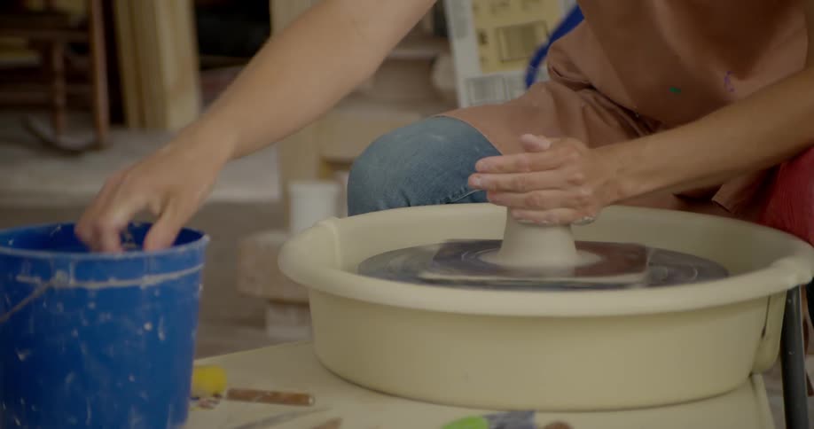 A person molding clay
