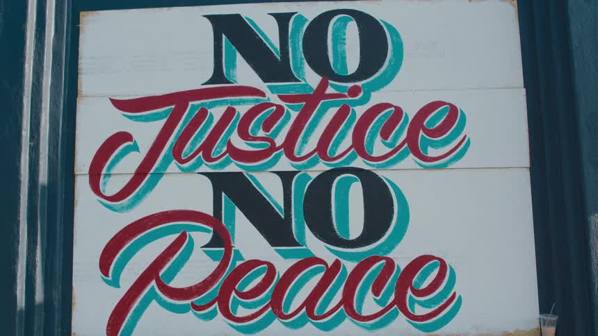 Colorful hand painted sign on a wall in the street