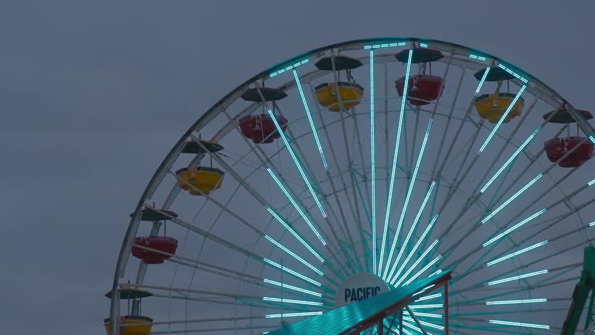 Lights on a ferris wheel are making interesting patterns