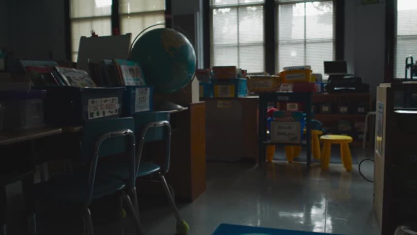 Dimly lit empty classroom in a school at morning