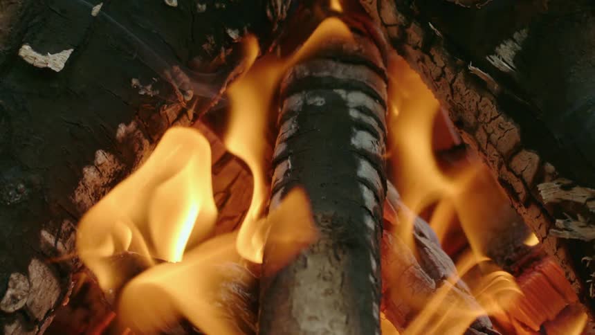 Flames are rising from a campfire