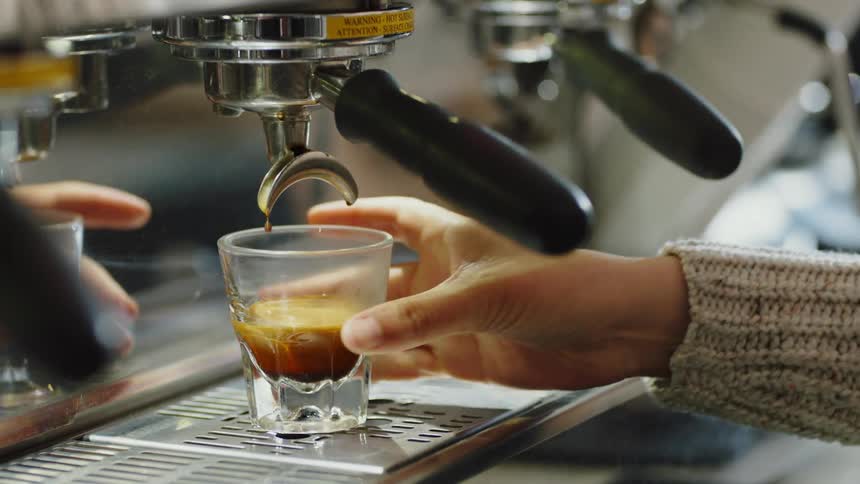 Person mixing coffee