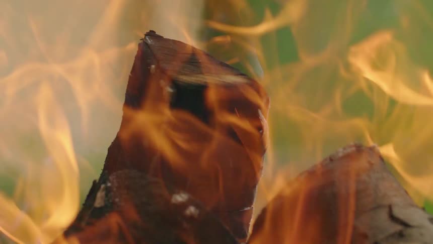 Wood burning with fire ash and smoke