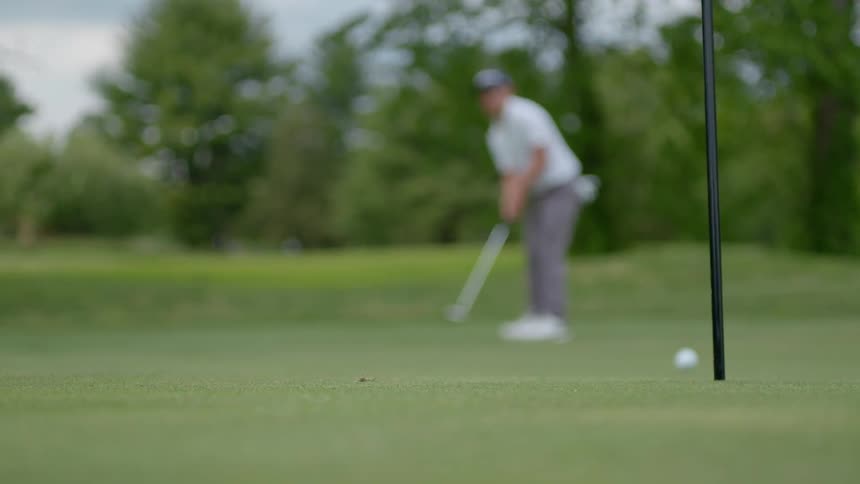 Person playing golf