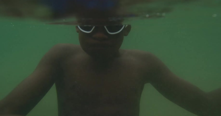 Two teenagers dunk underwater together