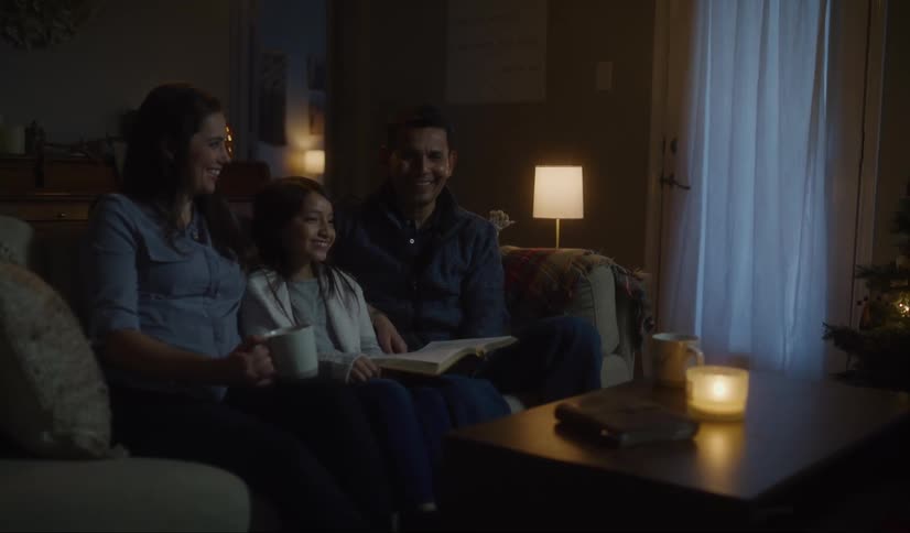 Family sitting on couch