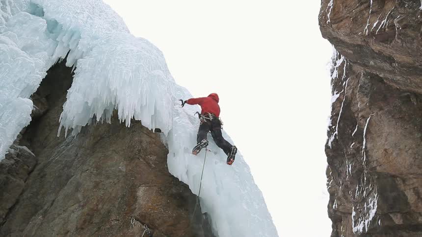 A man is ice climbing
