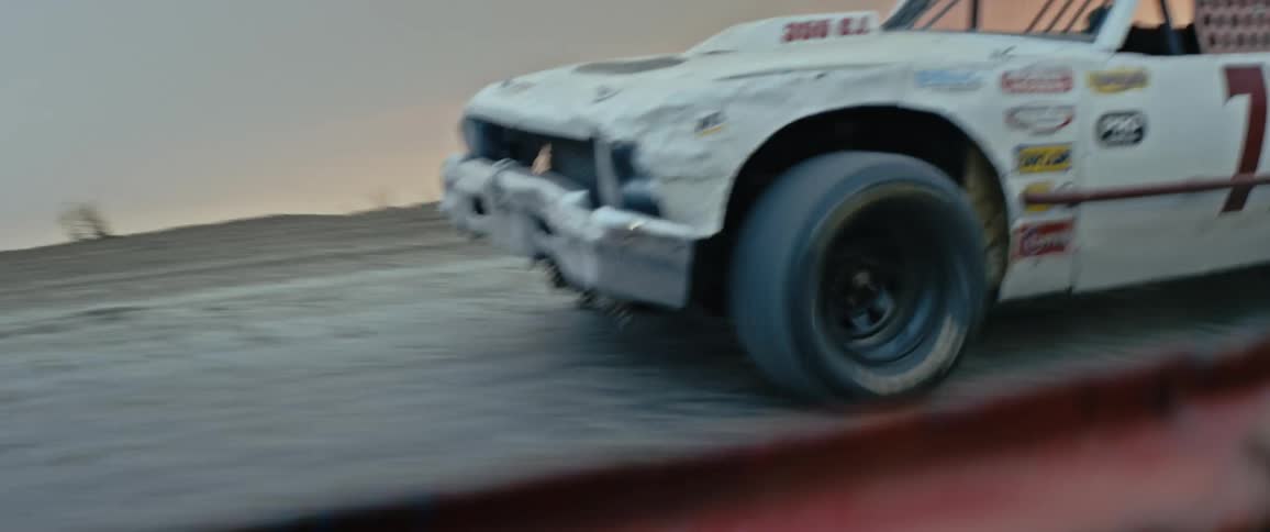 A race car is speeding along a road