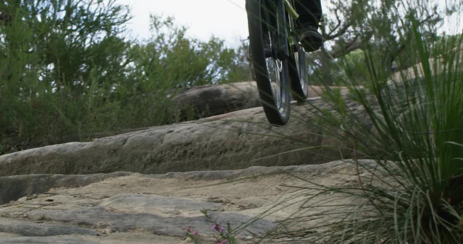 A man is mountain biking outdoors