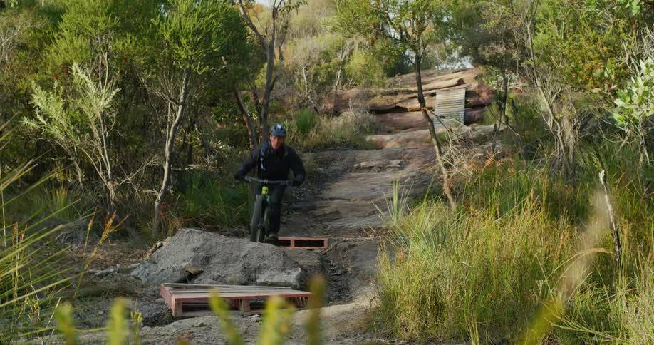 Man cycling down hill