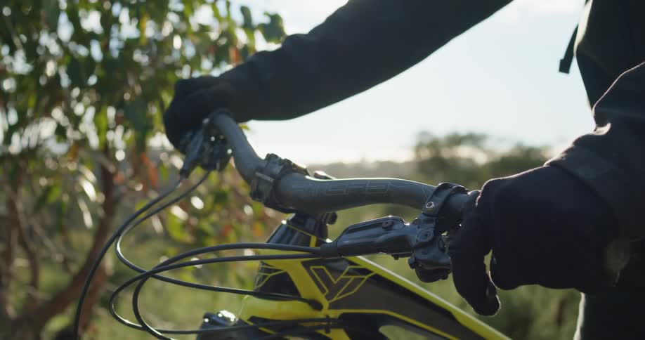 A person standing with a bike