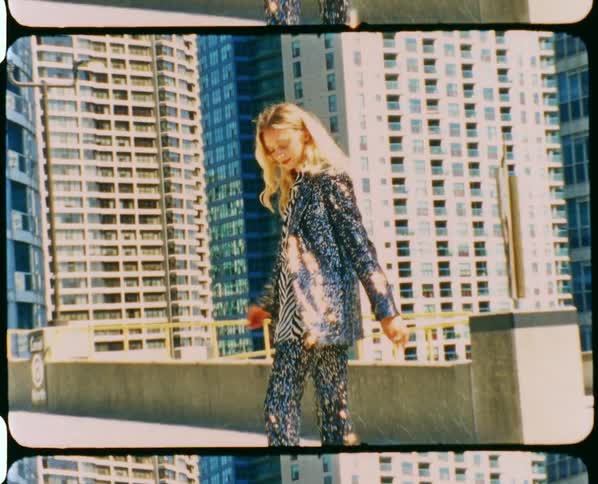 A woman posing for a portrait outdoors