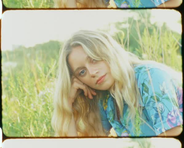 Woman sitting in grass