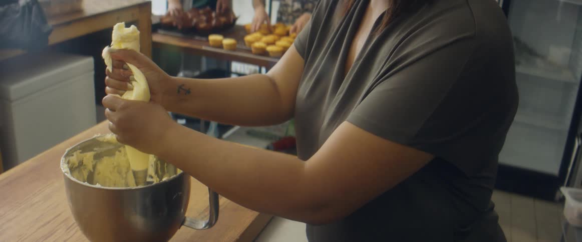 People are preparing pastries in the bakery