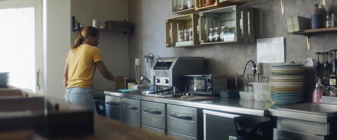 Woman cleaning worktop