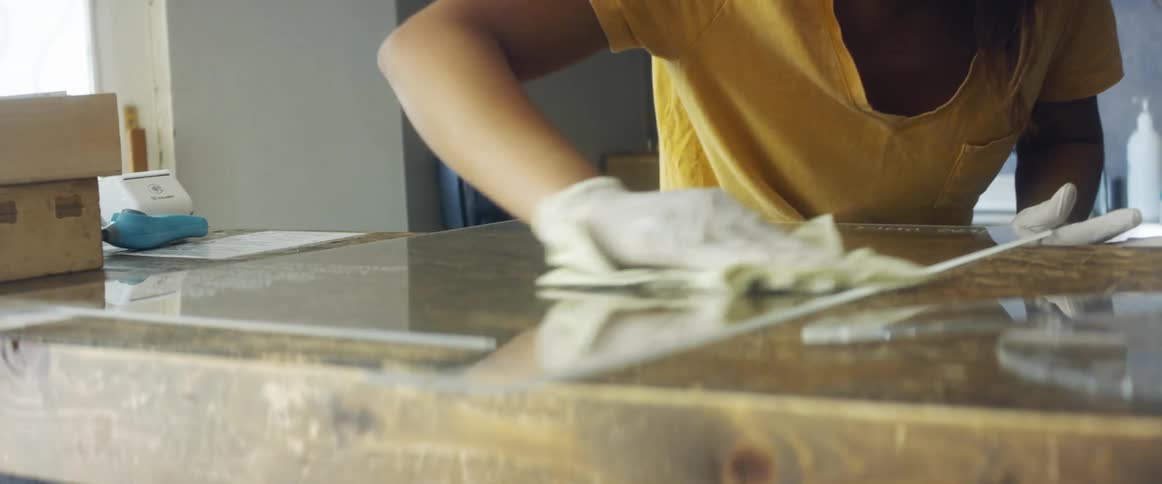 Woman cleaning worktop
