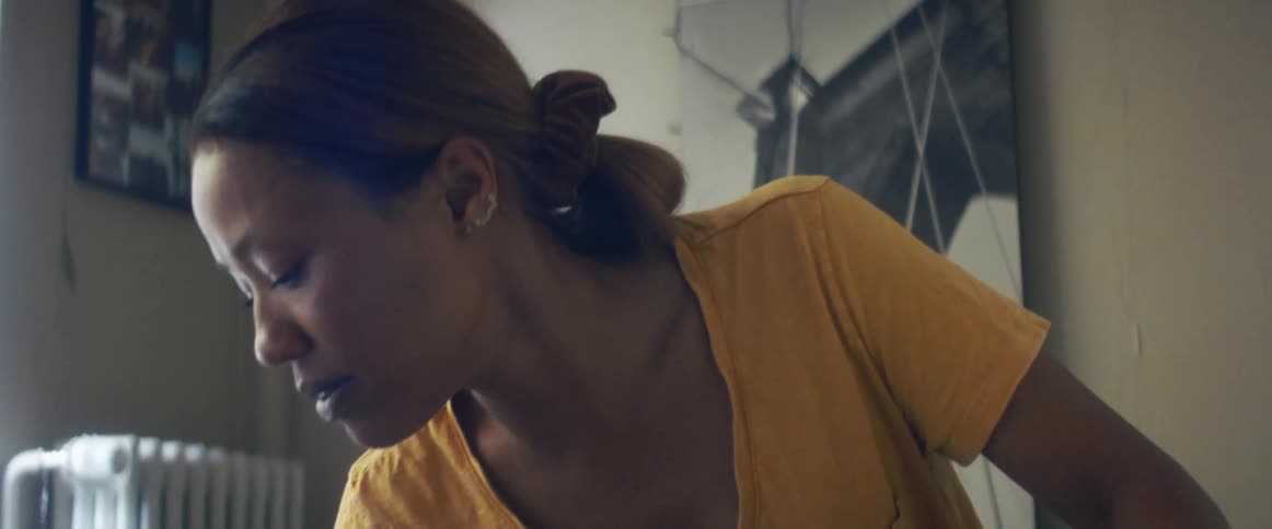 A woman cleaning tables