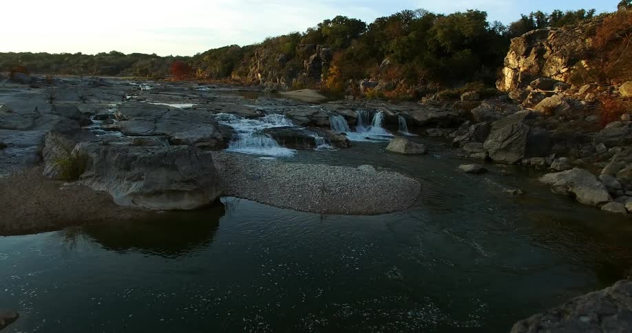 A river flows over rocks on a late fall afternoon