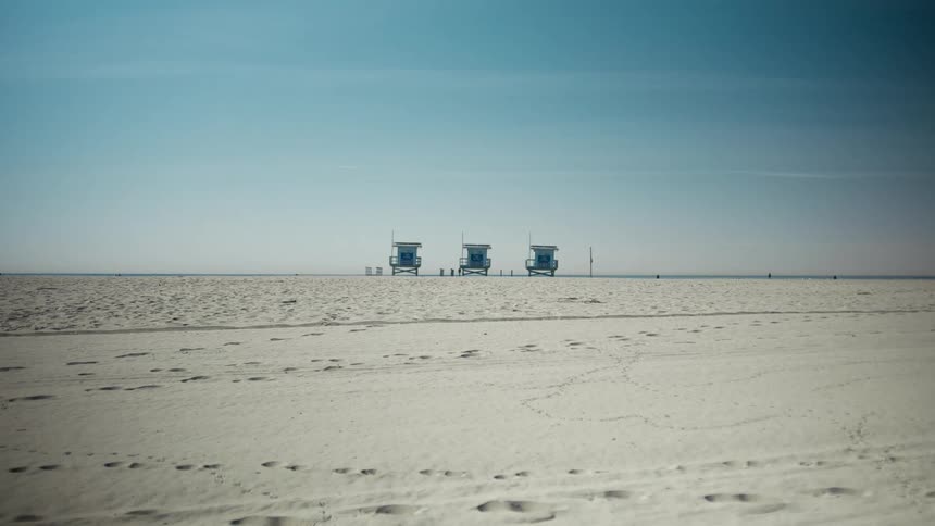 Three structures standing in the distance