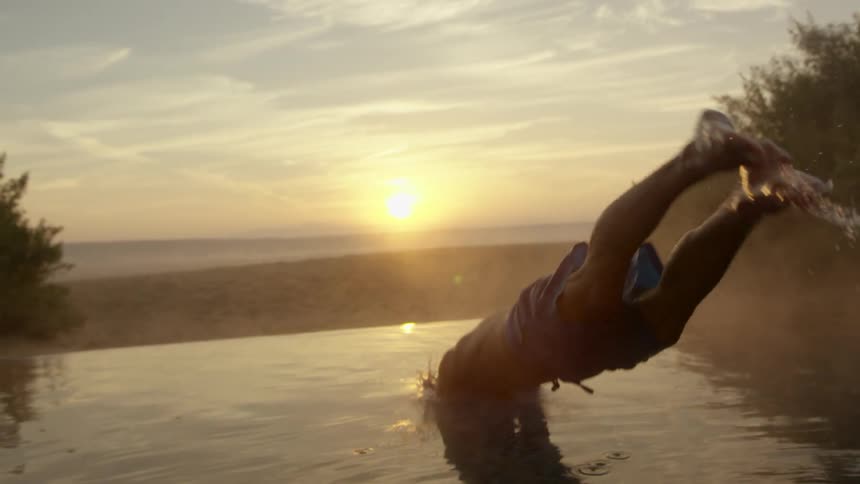 A man dives in the water