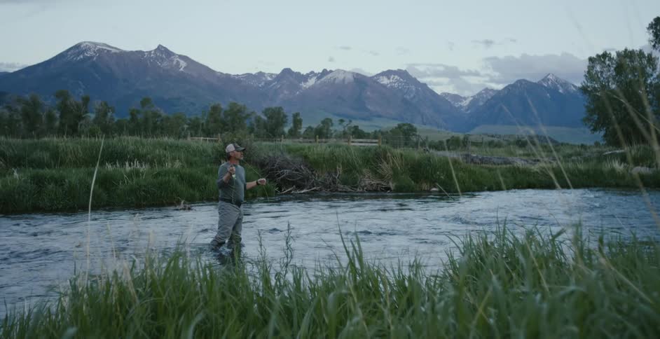 A man fly fishing in a river