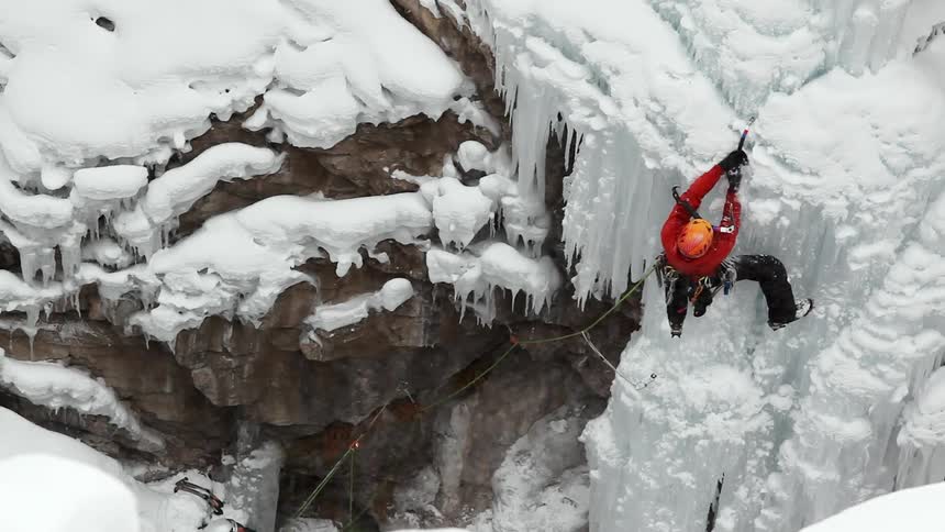 A man is climbing on ice