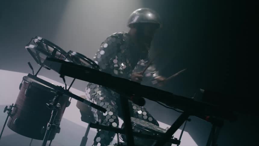 A drummer using a drum set