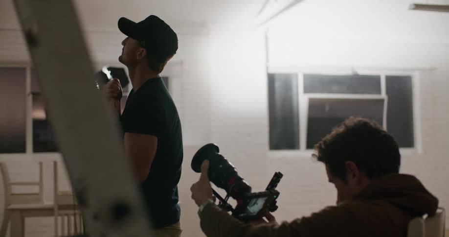 Two photographers taking pictures in a studio