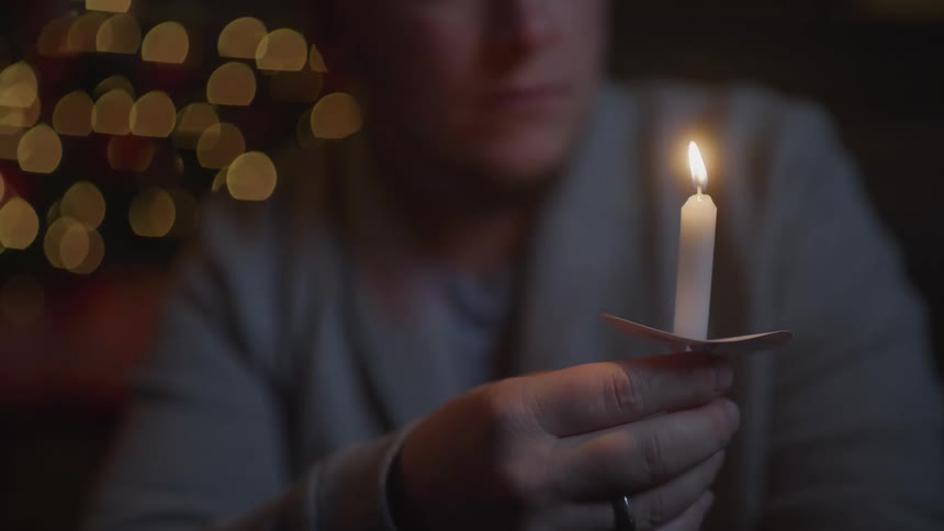 Person holding candle