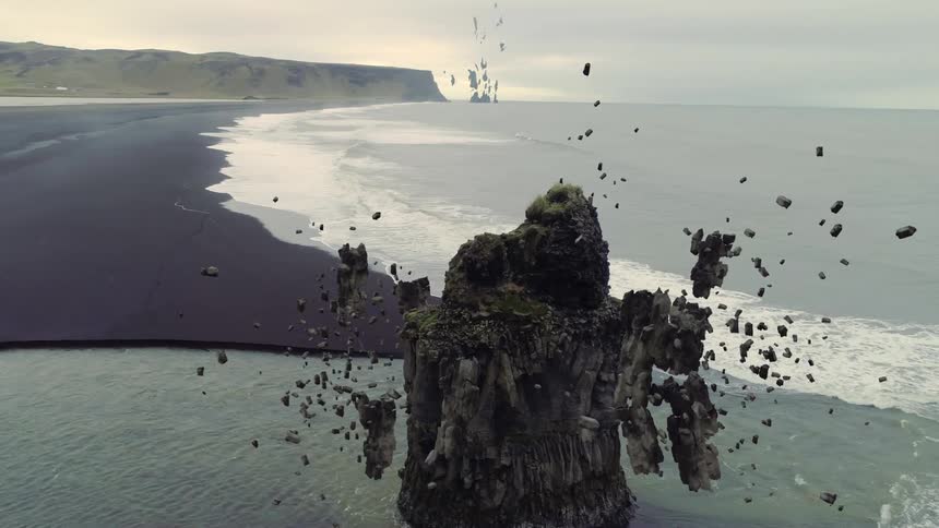A view of rocks floating up from the ocean