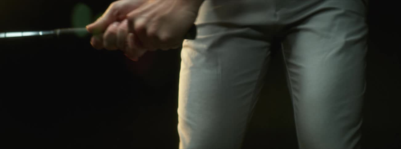 A view of a person swinging a golf club