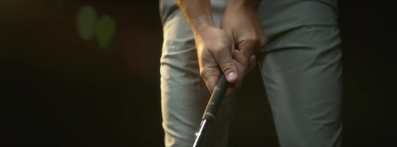 Person holding a golf club
