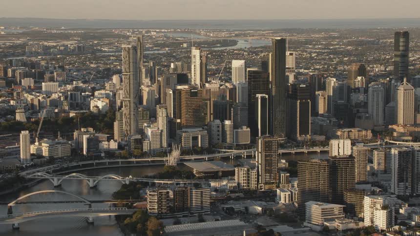 Aerial view of the tall skyscrapers on the city skyline at sunset
