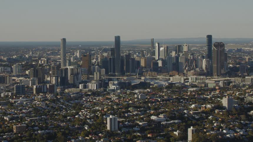 Neighborhood homes and apartment buildings lead to city skyscrapers and buildings