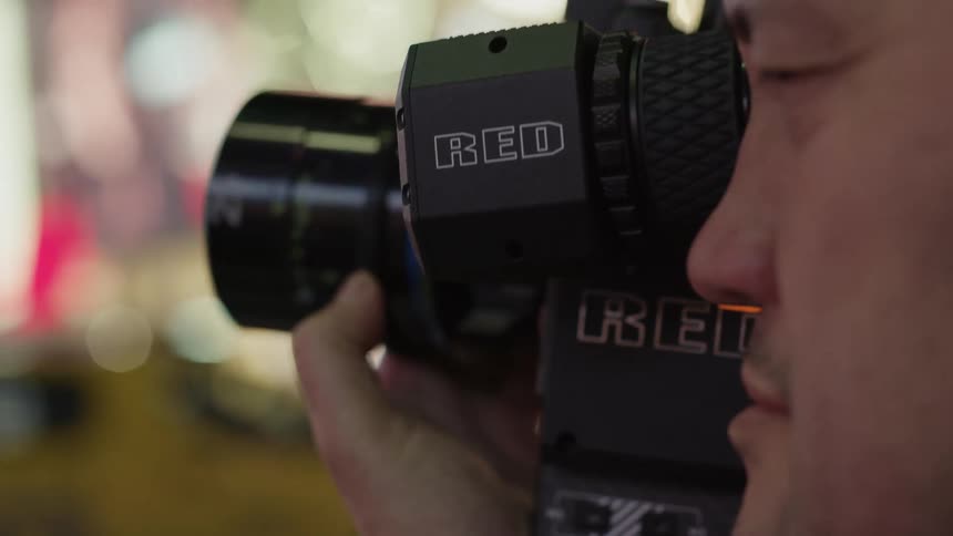 A view of a person using a camera outdoors