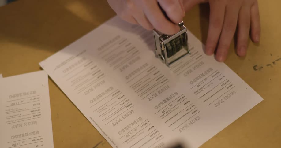 A person using a stamp on a document