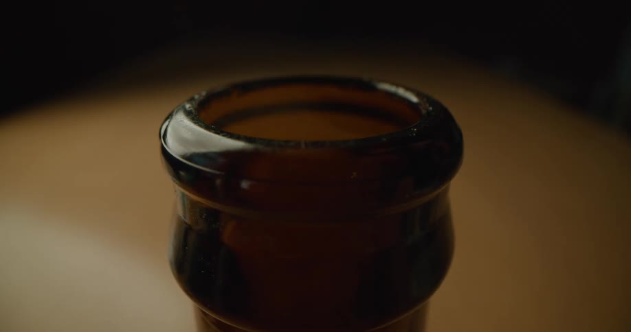 Person opening a bottle