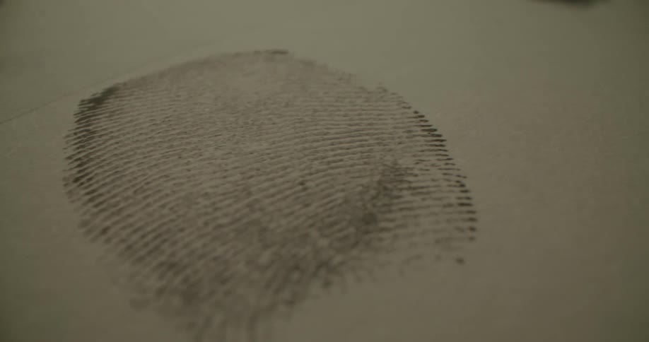 A close up of a persons inked fingerprint