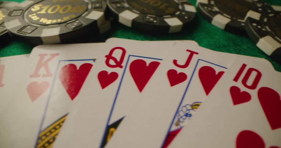 Poker chips and cards sitting on a table