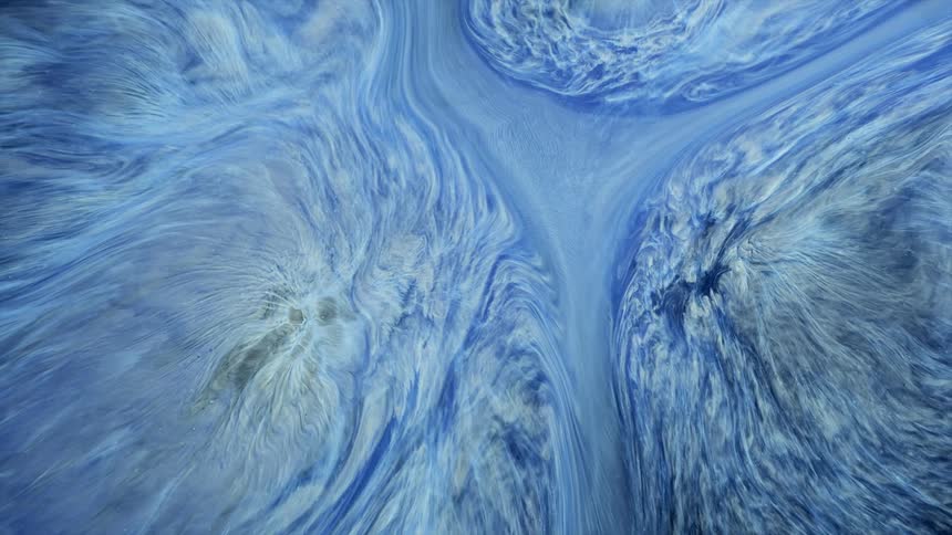 Blue and white streaks of flowing bright liquid ink