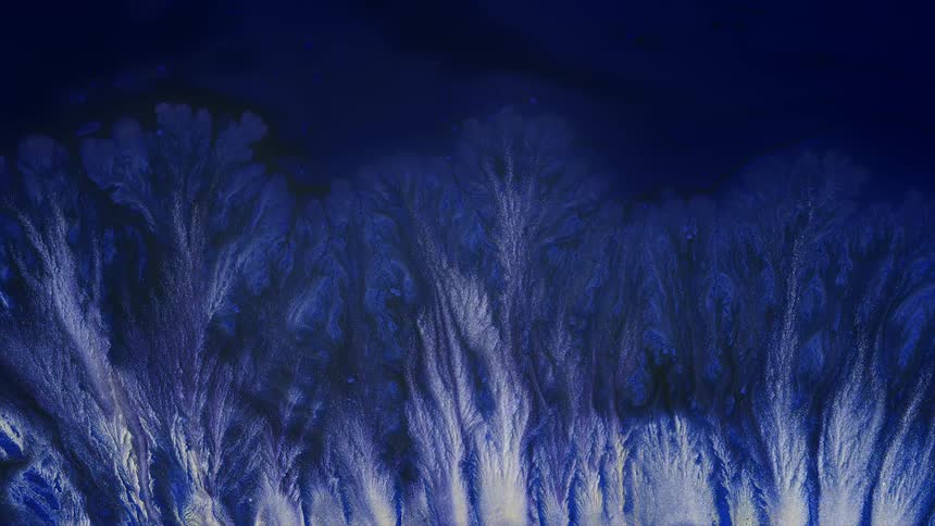 silver and blue paint forming abstract shapes of branches and roots