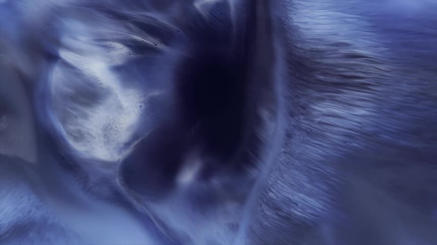 Flowing purple and white liquid