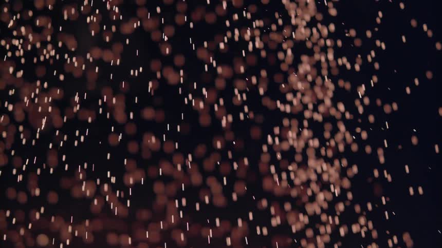 Sparks fly in a dark area