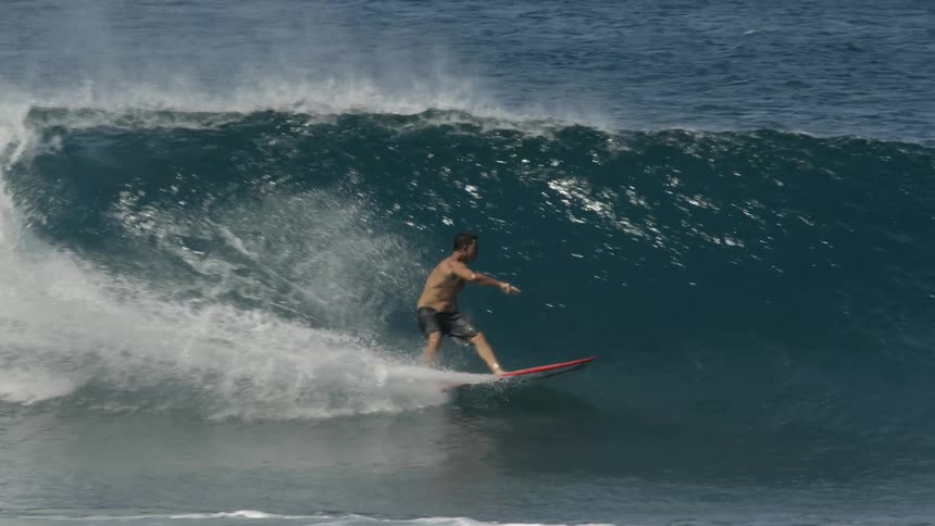 Two people surfboarding