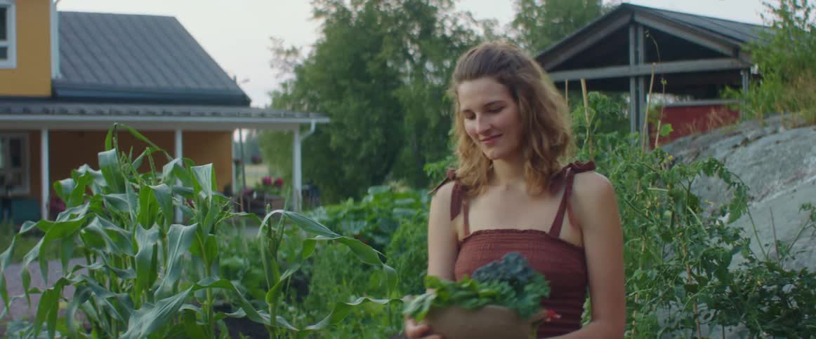 A woman walking in a garden