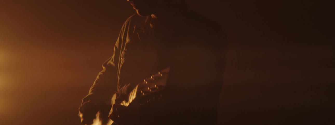 A man playing a guitar