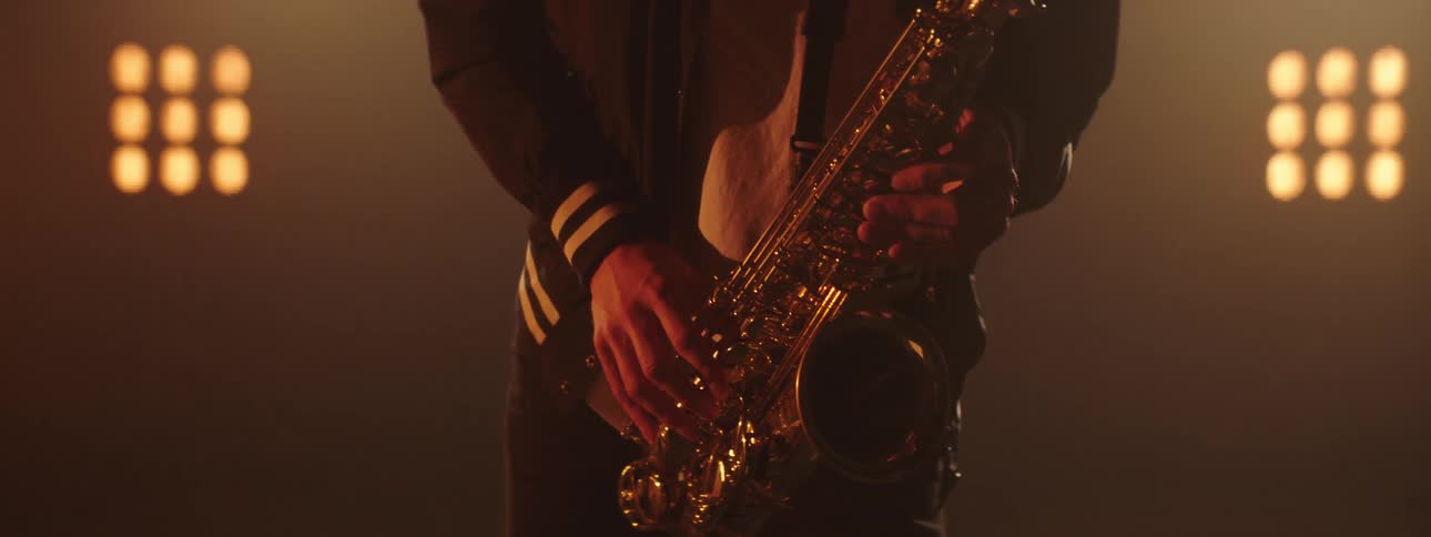 A man playing a saxophone on a stage