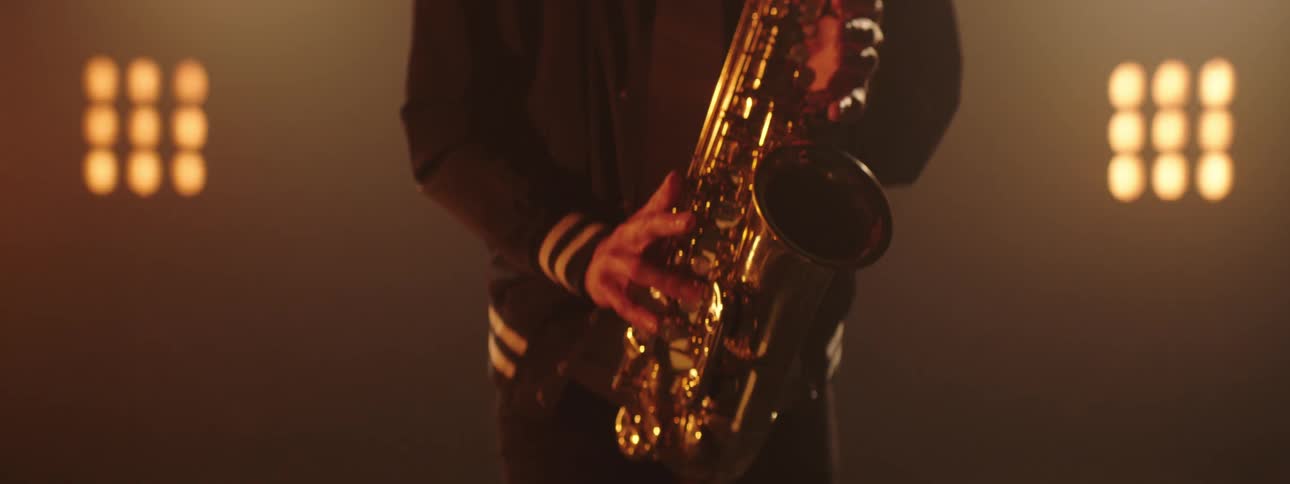 A man playing saxophone on a stage