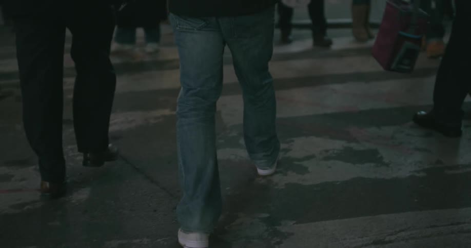People are walking in the street at night